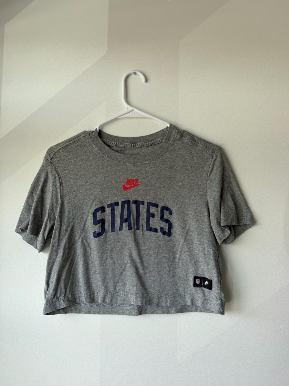 Nike Gray Cropped Tee with Navy 'STATES' and Red Swoosh